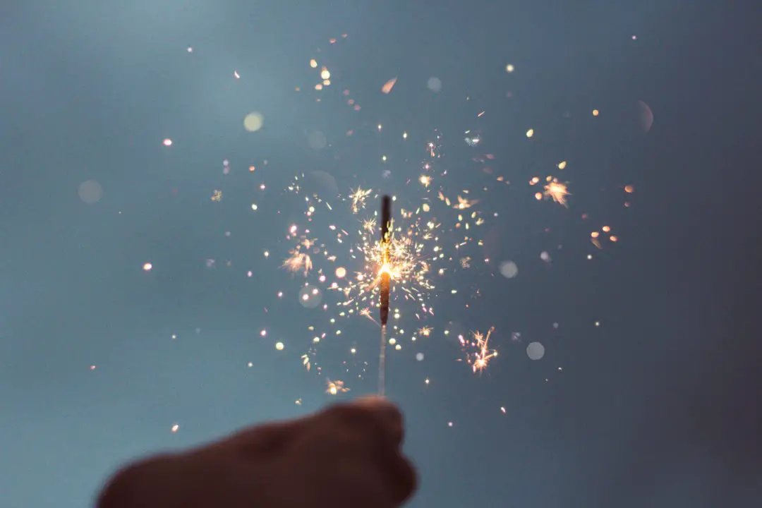new hobbies for 2020, hand holding sparkler up to the sky