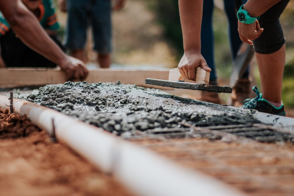 people setting cement volunteering hobby