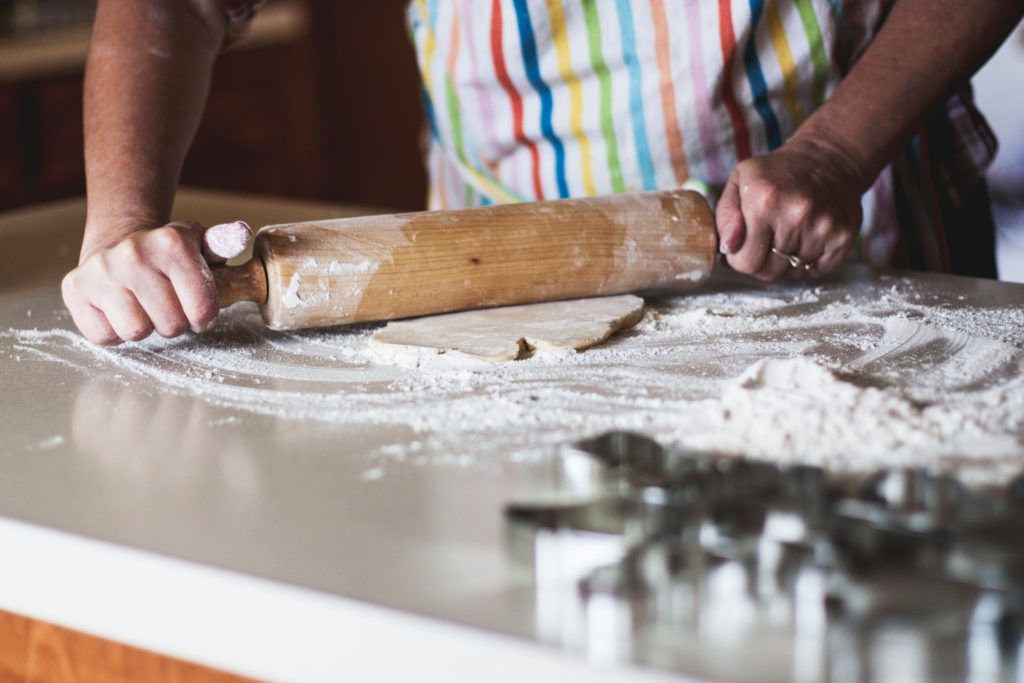 home hobby baking; cupcakes, bread cake; close up of rolling pin and hands