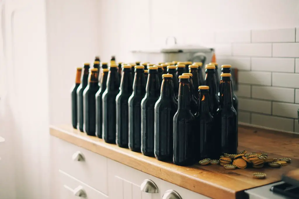 Brown beer bottles on kitchen counter 