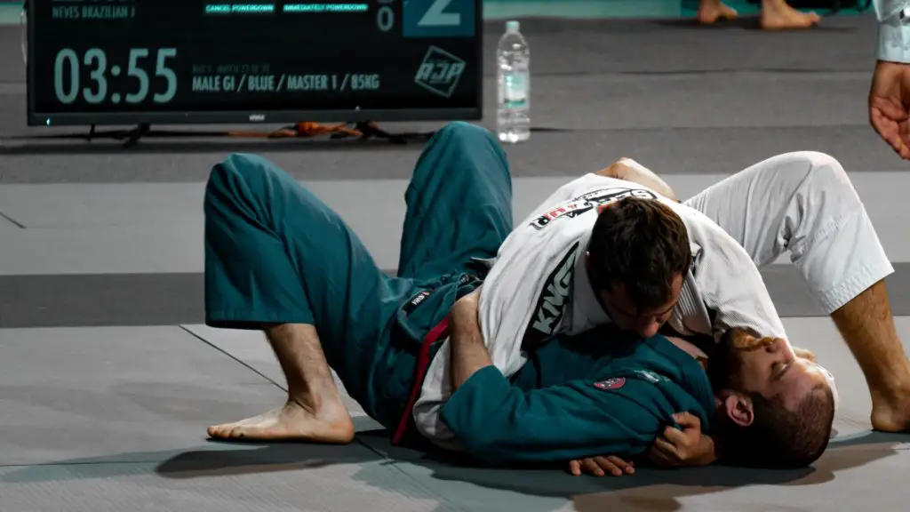two men grappling during a martial arts competition