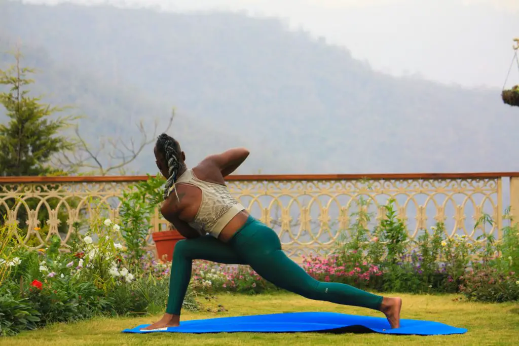 woman outdoors on yoga mat 