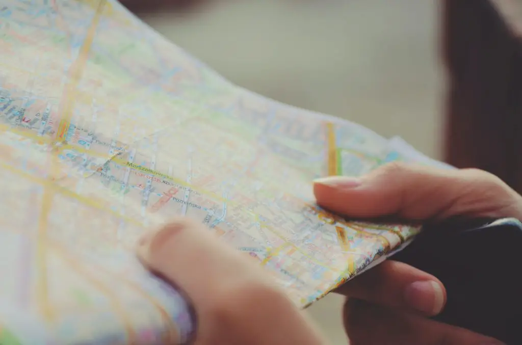 close up of woman holding a map