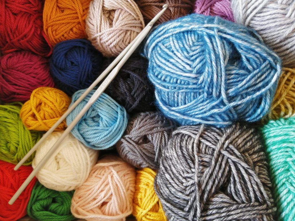 overhead view of yarn for knitting. Knitting is a great hobby for pregnant women to create during the day.