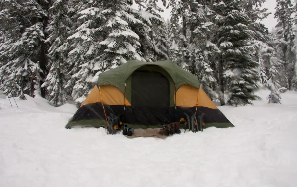 outdoor winter hobby; winter camping tent in the snow