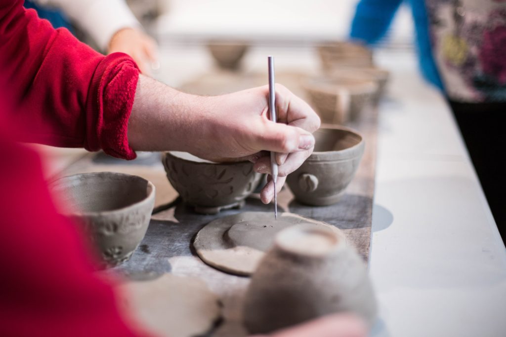 close up of hand creating pottery.  Creative hobbies everyone should have