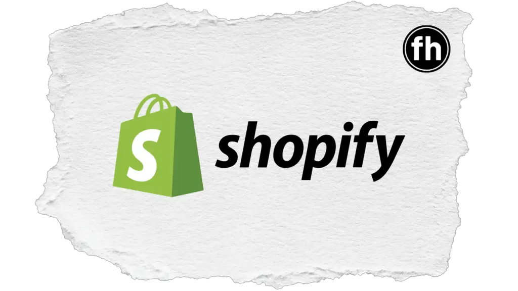 Shopify logo on top of a ripped piece of paper graphic. (Sell digital downloads with Shopify)
