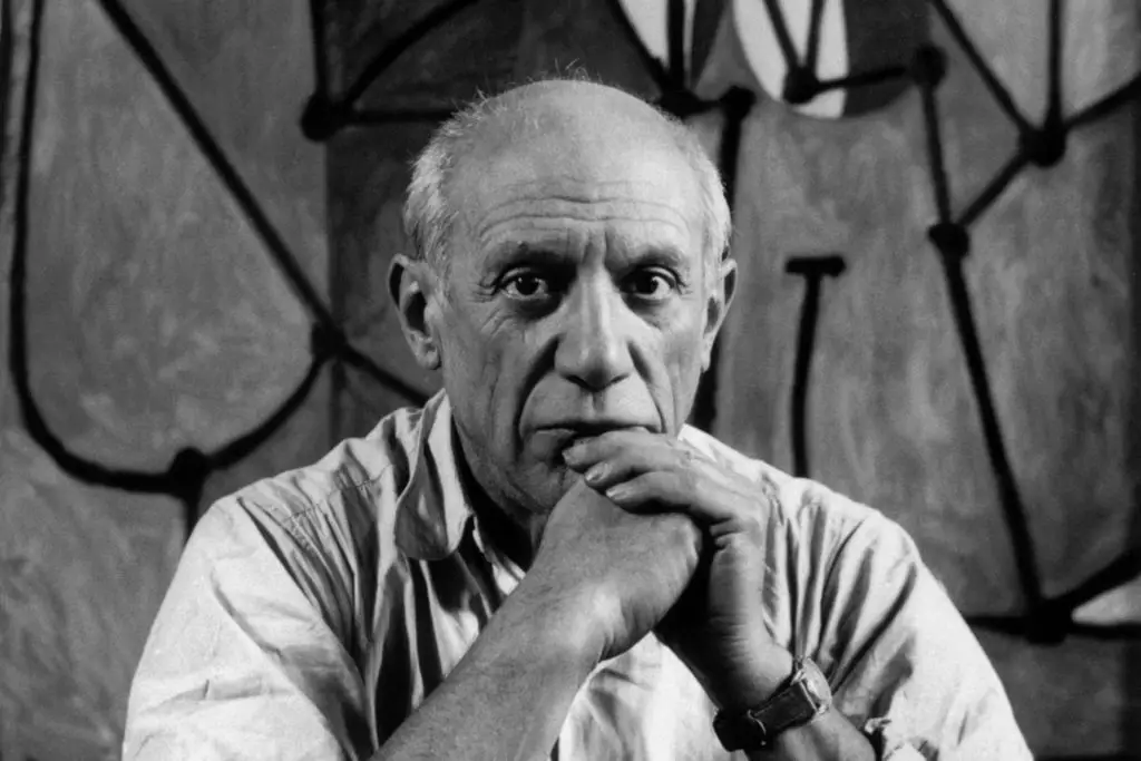 painting quotes from Pablo Picasso, black and white portrait arms crossed touching chin