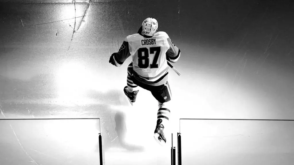 Sidney Crosby black and white getting on the ice, back of jersey, hockey quotes