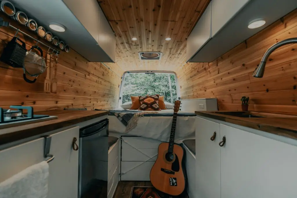 van life hobby with guitar and open window