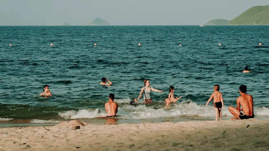 people swimming at the beach